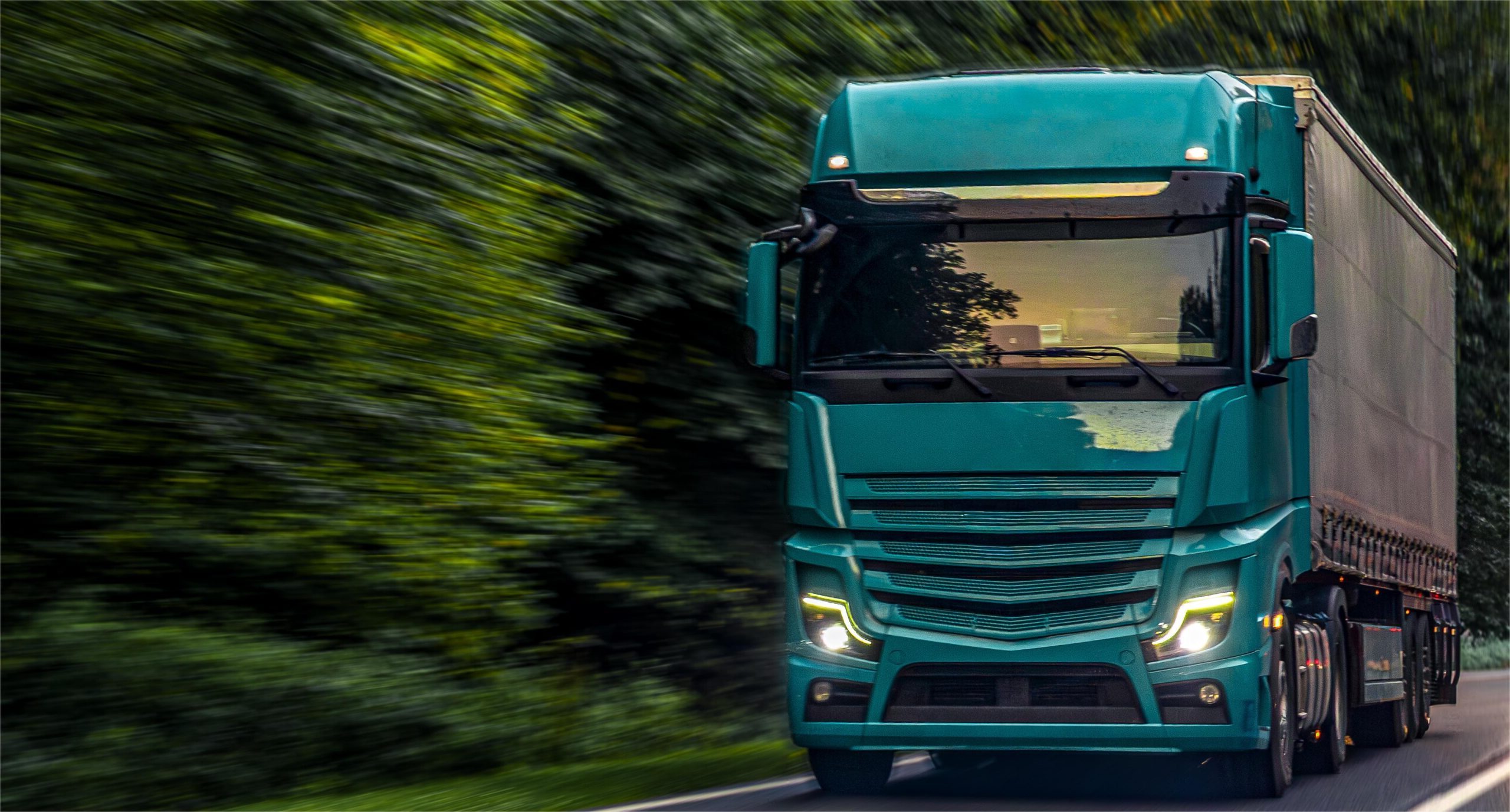 emerald-green-truck-forest-highway-modern-power-transport